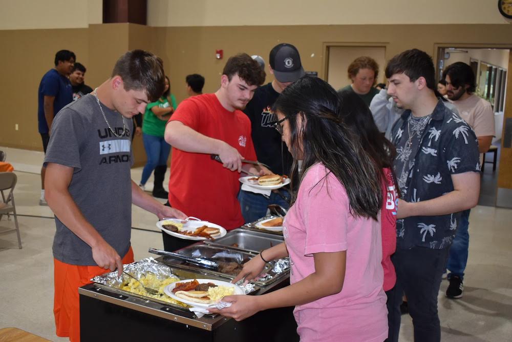 WHS Class of 2022 are served breakfast at Immanuel Friday morning