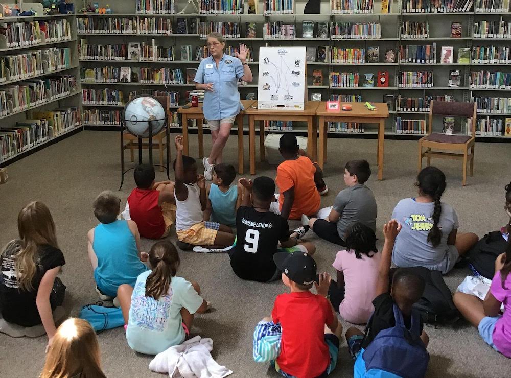 Laura Rogers of the Arkansas Game and Fish Commission visits Library summer reading students