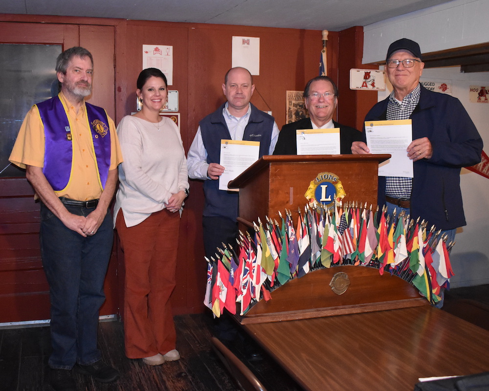 Four Warren Lions Club members honored for combined 95 years of service