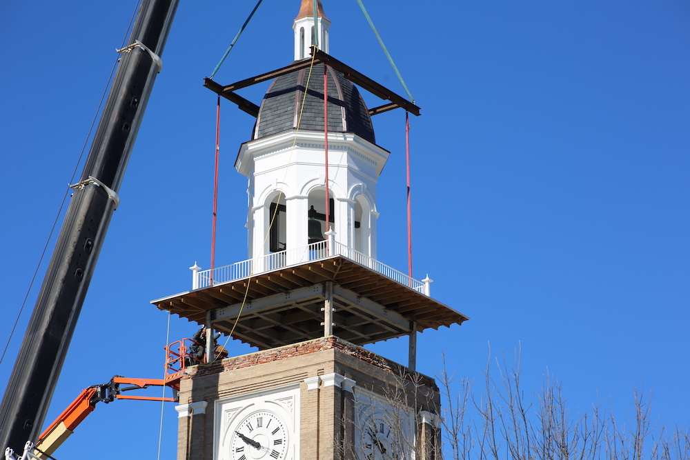 Clock tower top successfully lifted into place